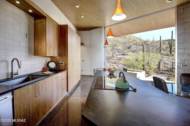 kitchen with pendant lighting, dark countertops, wood ceiling, a sink, and dishwasher