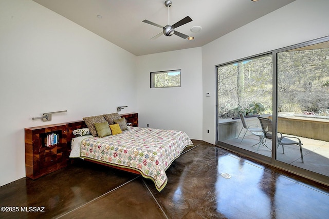 bedroom featuring concrete flooring, access to outside, and ceiling fan