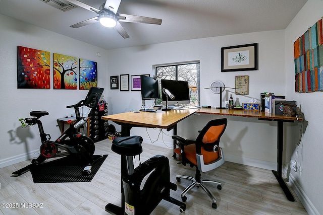 office space with light hardwood / wood-style floors and ceiling fan