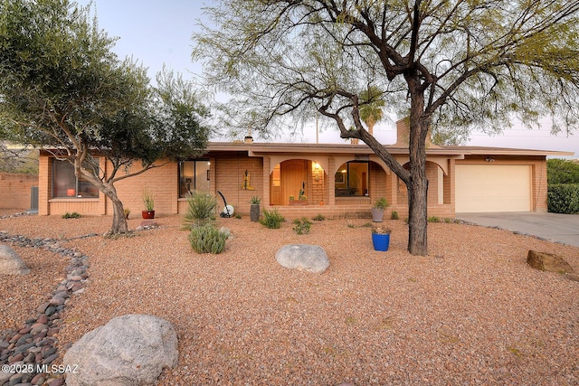 single story home with a garage