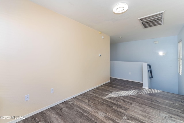 spare room featuring dark hardwood / wood-style floors