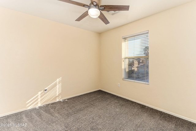 carpeted spare room featuring ceiling fan