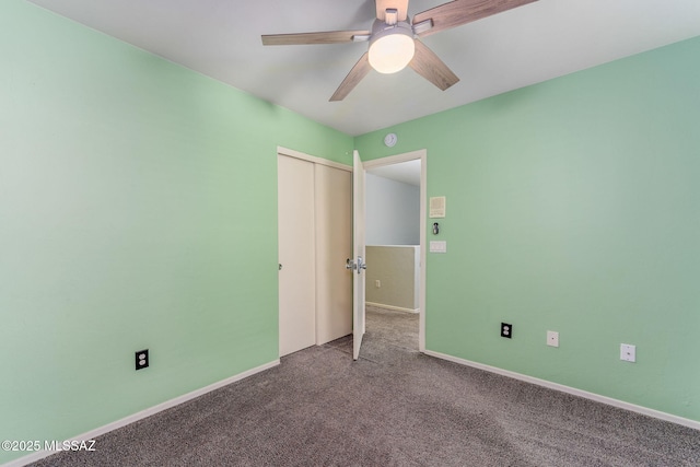 unfurnished bedroom with ceiling fan, a closet, and carpet floors