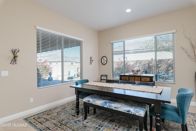 tiled office space featuring baseboards, a wealth of natural light, and recessed lighting