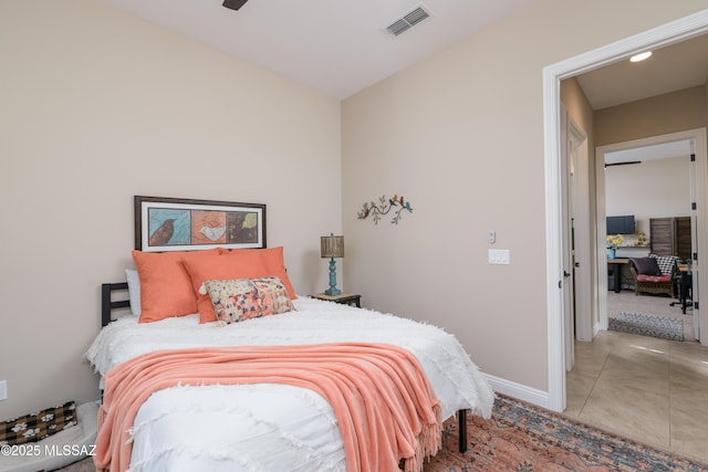 bedroom featuring tile patterned flooring, baseboards, and visible vents