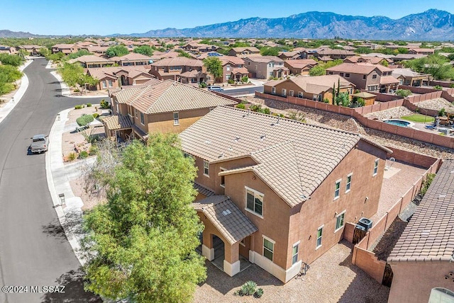 birds eye view of property with a mountain view