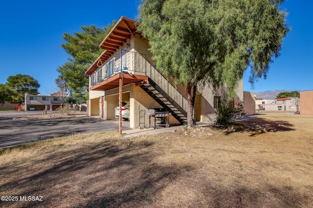 back of property featuring a garage