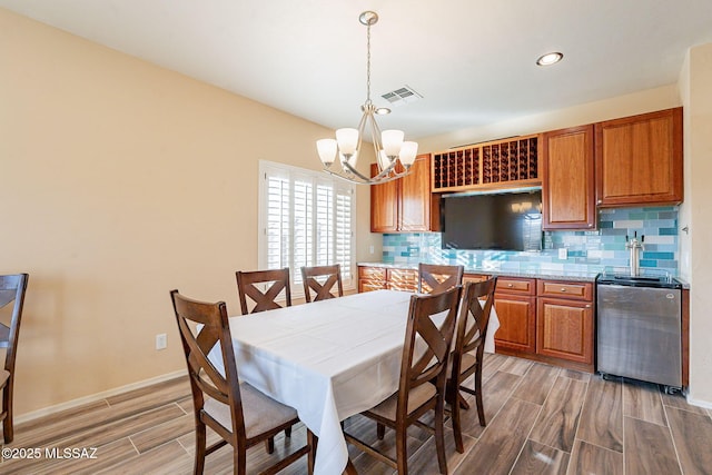 dining area featuring a notable chandelier