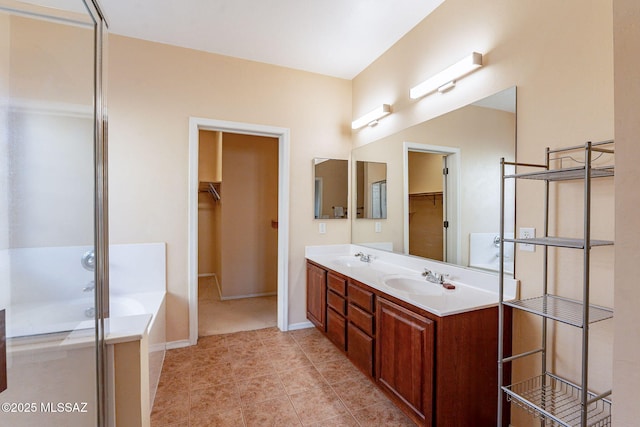 bathroom featuring vanity and a washtub