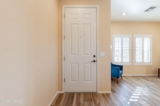 doorway to outside with light hardwood / wood-style flooring