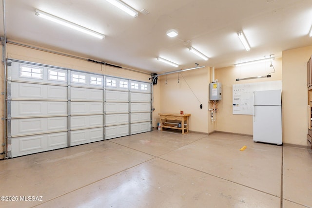 garage featuring white refrigerator and water heater