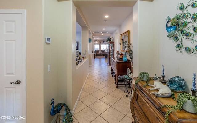 hallway with light tile patterned floors