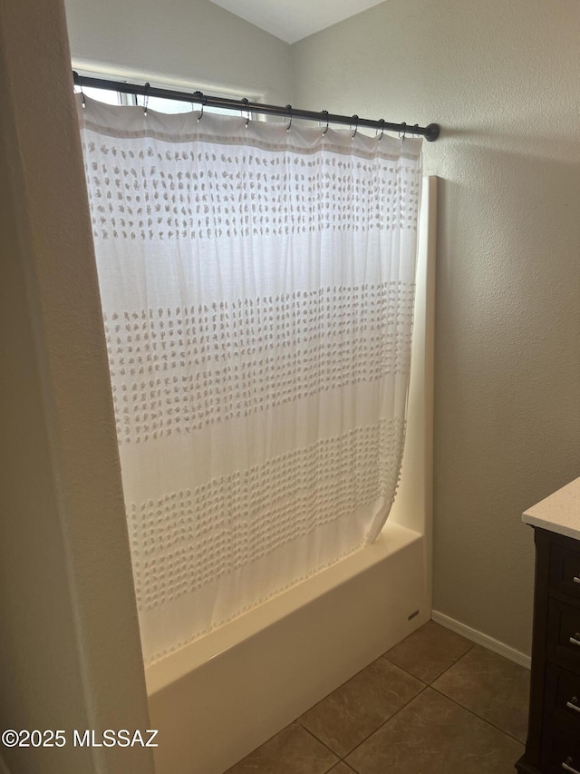 bathroom with shower / bath combination with curtain, tile patterned floors, and vanity