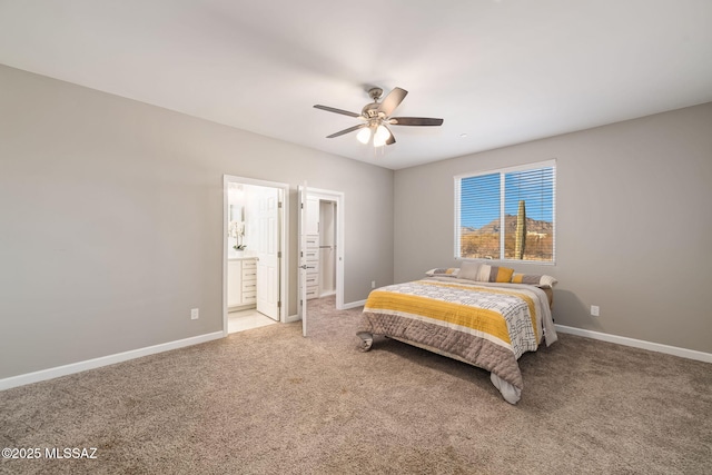 bedroom with ceiling fan, connected bathroom, and carpet floors