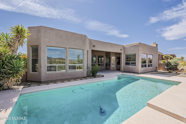 pool featuring a patio area