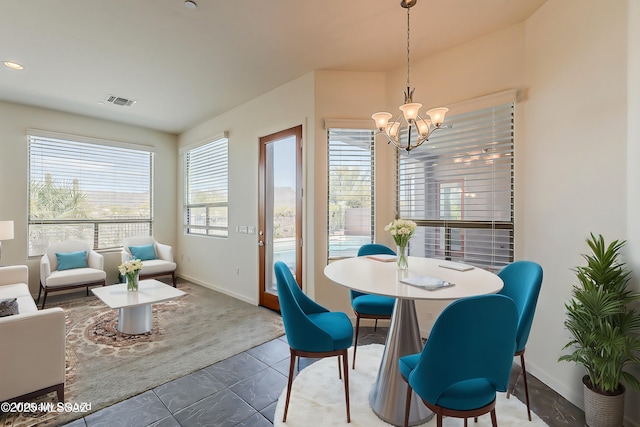 dining space featuring recessed lighting, visible vents, baseboards, and a notable chandelier