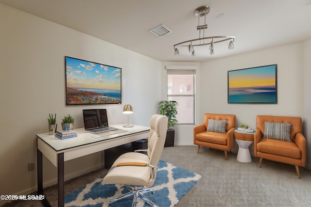 carpeted home office with baseboards and visible vents