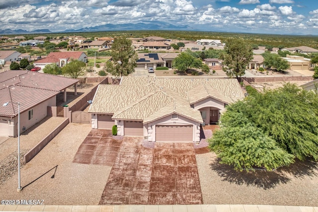 birds eye view of property featuring a mountain view