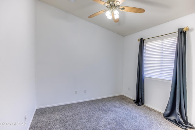 spare room with carpet and ceiling fan