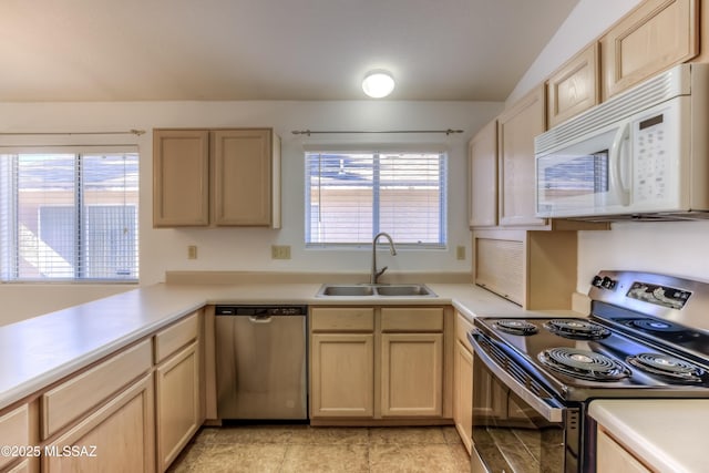 kitchen featuring sink, light brown cabinets, and appliances with stainless steel finishes