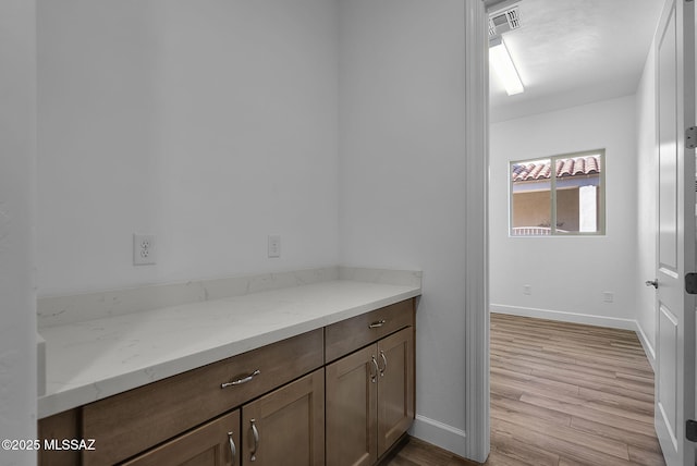 bathroom featuring wood-type flooring