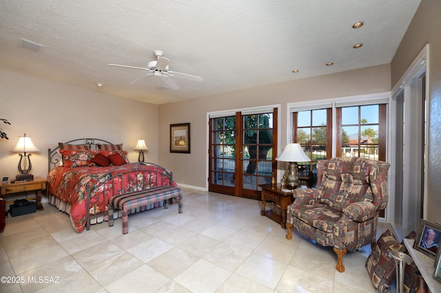 bedroom with a textured ceiling, ceiling fan, access to exterior, and french doors