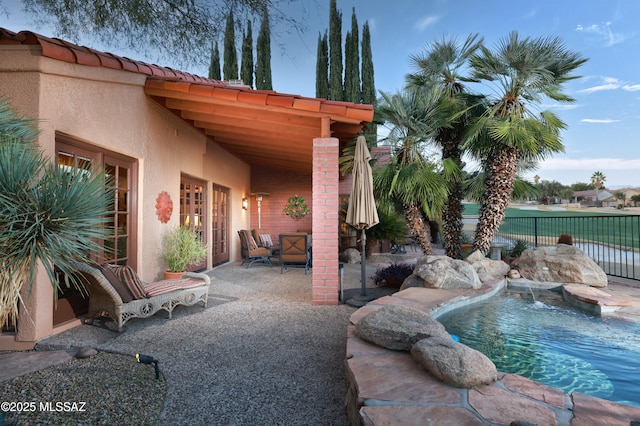 view of patio / terrace featuring a fenced in pool