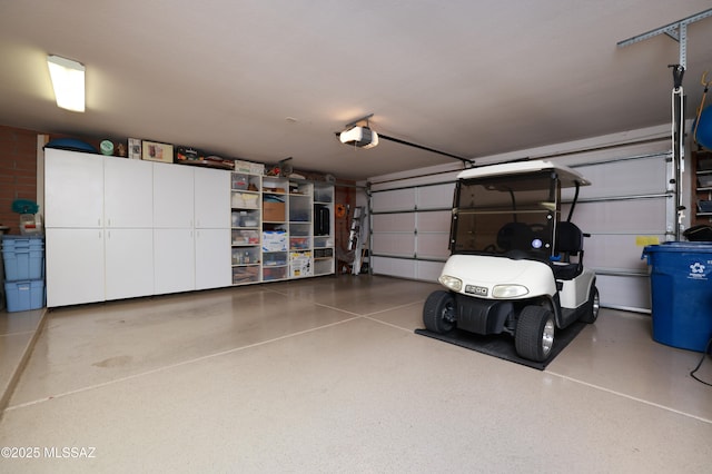 garage featuring a garage door opener