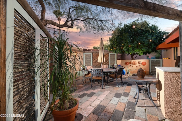 view of patio terrace at dusk