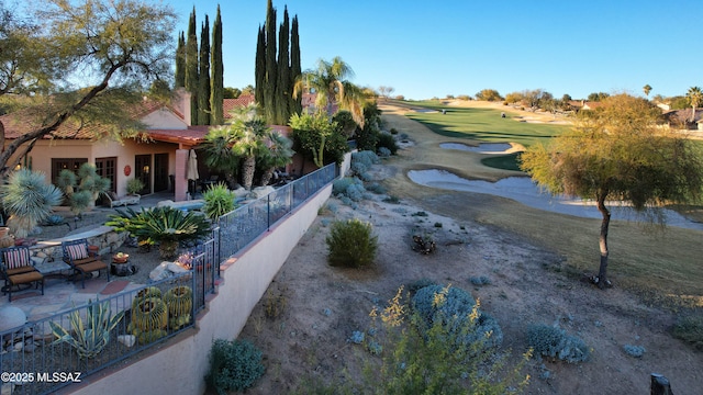 view of home's community featuring a patio area