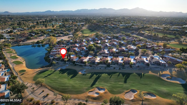 aerial view featuring a water and mountain view