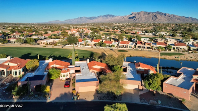 bird's eye view featuring a water and mountain view