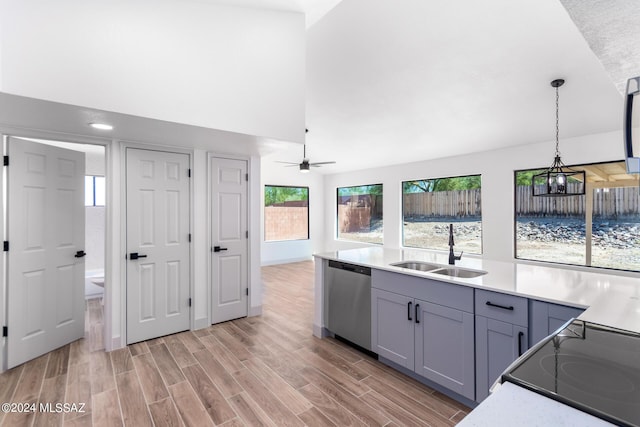 kitchen with ceiling fan, dishwasher, gray cabinets, sink, and hanging light fixtures