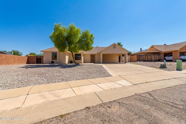 ranch-style home with a carport