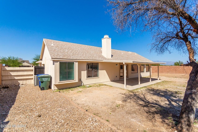 back of property with a patio area