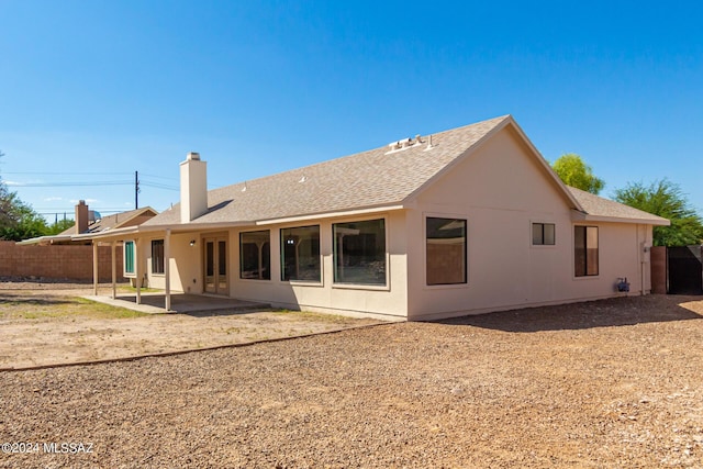 rear view of property with a patio