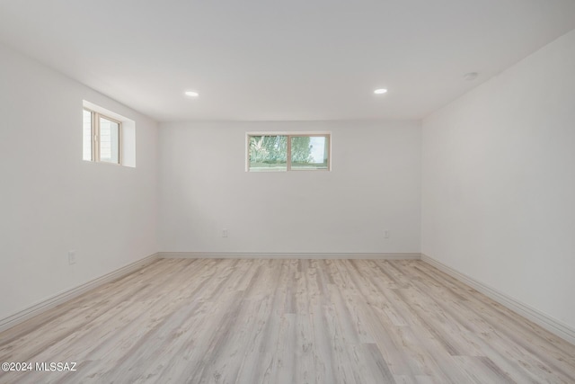 spare room featuring light hardwood / wood-style flooring