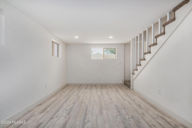 basement with light hardwood / wood-style floors