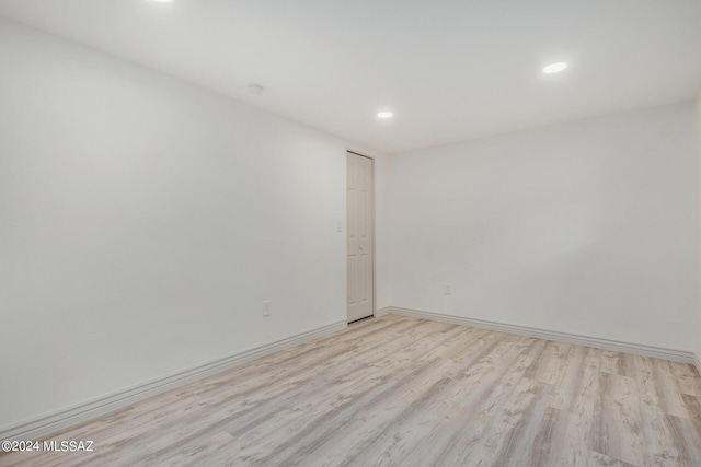 spare room with light hardwood / wood-style floors