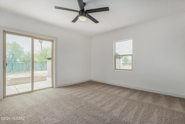 empty room with carpet floors and ceiling fan