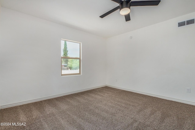 spare room with ceiling fan and carpet flooring