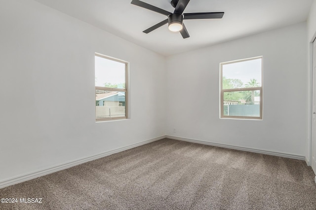 carpeted empty room with ceiling fan