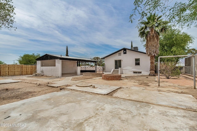 back of house with a patio