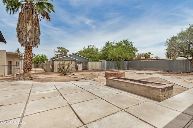 view of patio / terrace featuring an outdoor fire pit