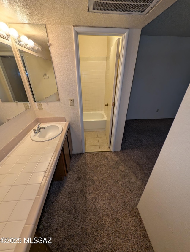 bathroom with vanity and tile patterned floors