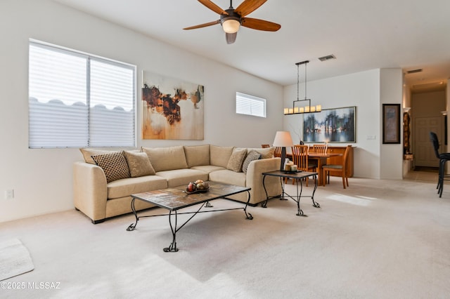 living room with ceiling fan and light colored carpet