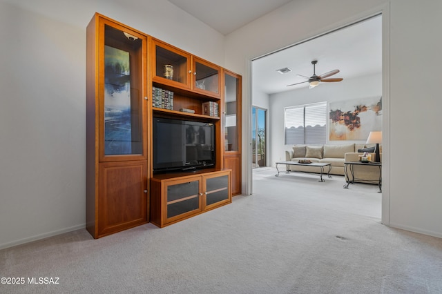 living room with ceiling fan and light carpet