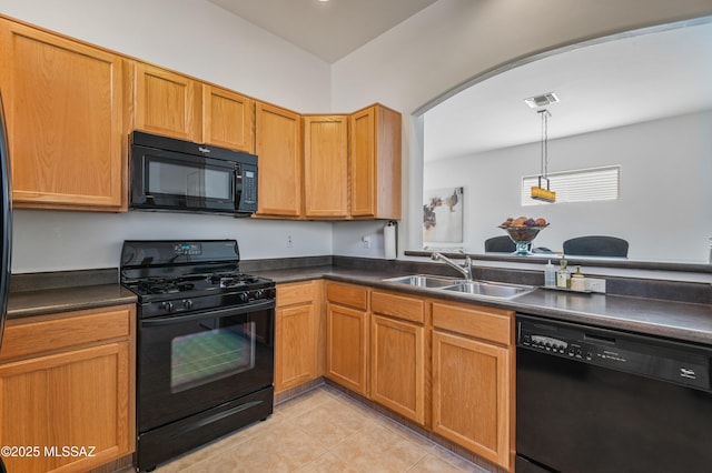 kitchen featuring black appliances, pendant lighting, sink, and light tile patterned floors