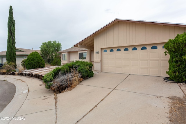 single story home featuring a garage