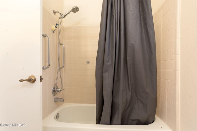 bathroom featuring shower / bath combo with shower curtain